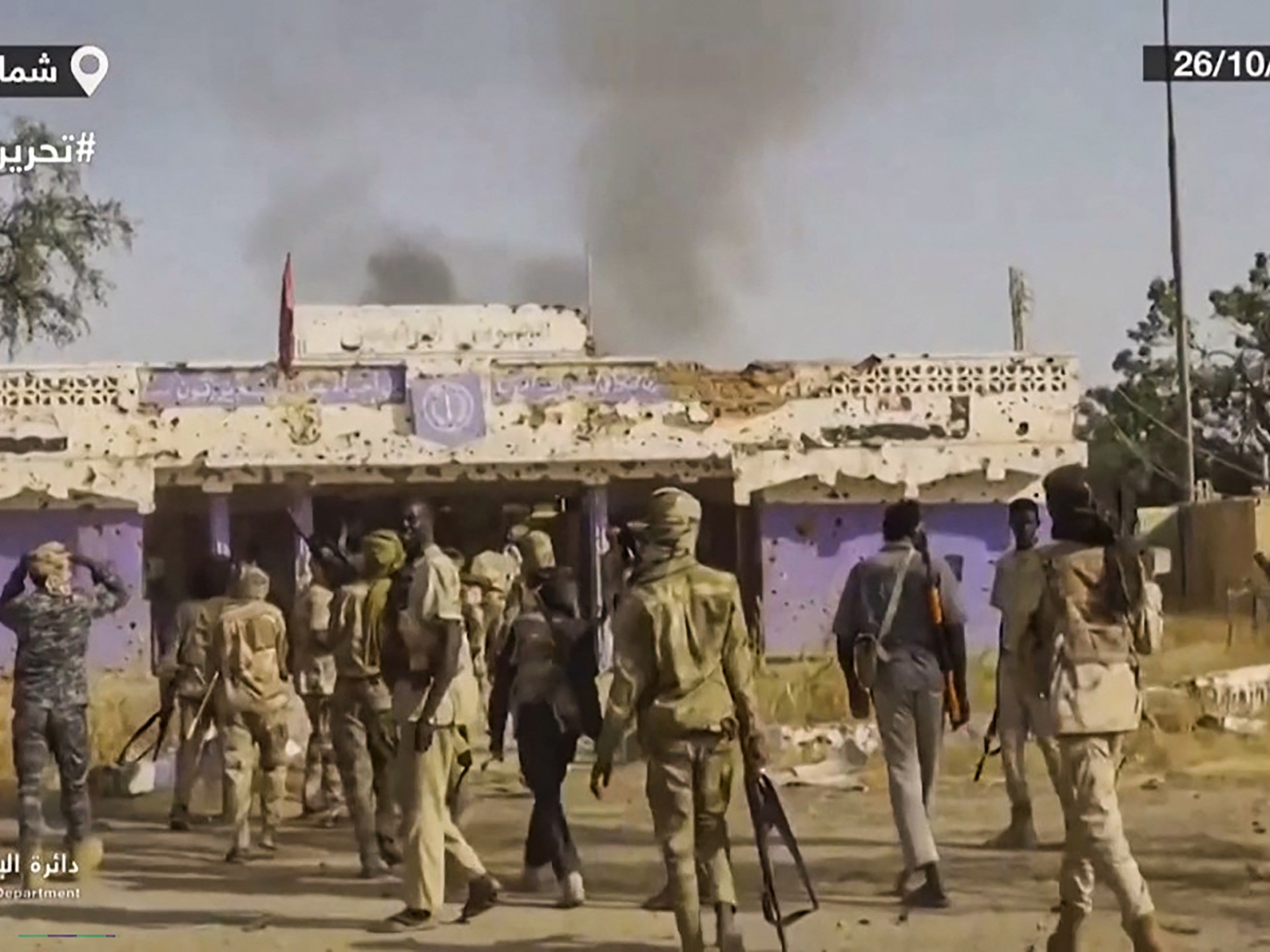 RSF fighters celebrating in El-Fasher, Sudan, highlighting ethnic cleansing allegations.