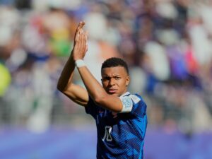 Kylian Mbappe applauds fans after France's World Cup Group I match against Senegal.