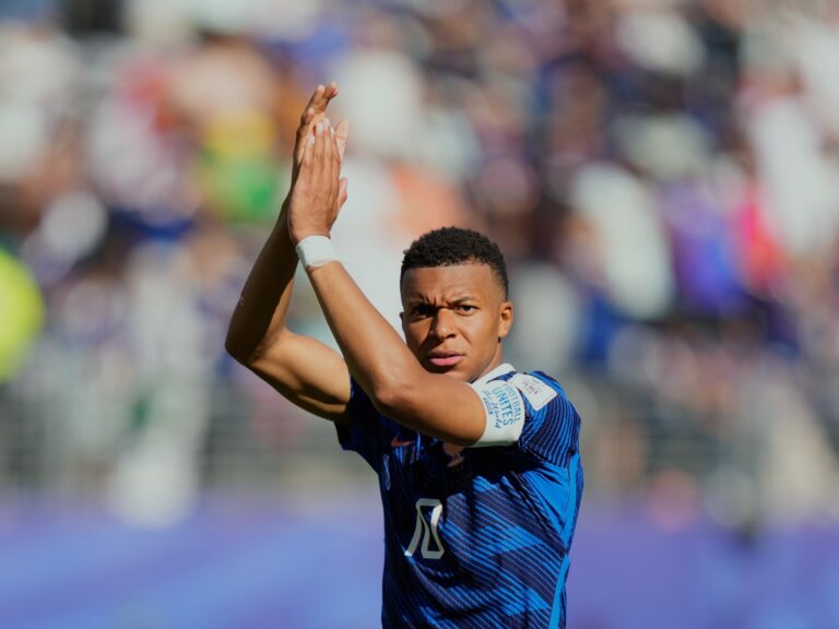 Kylian Mbappe applauds fans after France's World Cup Group I match against Senegal.