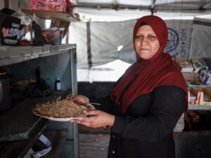 Exploration of the severe impact of prolonged electricity shortages on Gaza families, focusing on food spoilage, medicine preservation, and daily struggles without refrigeration.