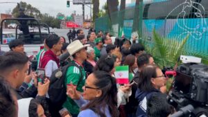 Mexican fans gather to cheer the Iran national football team in Tijuana after their World Cup elimination.