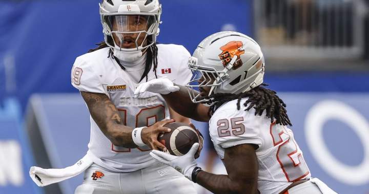B.C. Lions quarterback Kaidon Salter hands off to Emani Bailey during CFL action against the Winnipeg Blue Bombers.