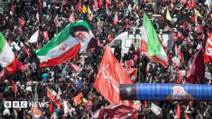 Vast crowds of mourners dressed in black gathered on a boulevard in Mashhad for the Supreme Leader's burial procession.