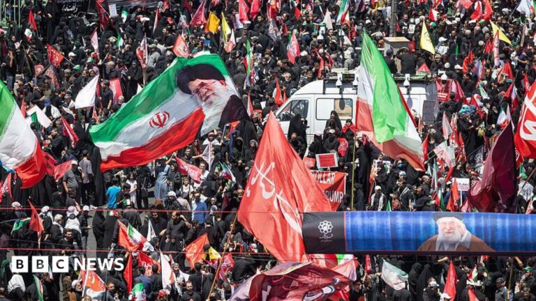 Vast crowds of mourners dressed in black gathered on a boulevard in Mashhad for the Supreme Leader's burial procession.