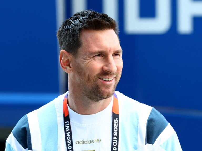 Lionel Messi smiles in his Inter Miami kit after returning to training.