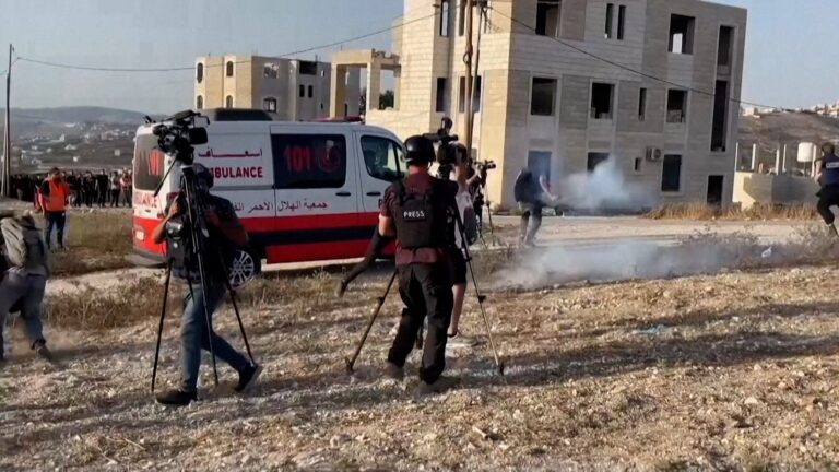 Israeli forces fire tear gas at journalists covering Nablus shootout aftermath.