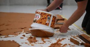 Rotterdam Museum Boijmans Van Beuningen covers a gallery floor with peanut butter for conceptual art tribute.