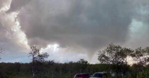 Image of a tornado touching down in the Canadian Prairies amidst a humid heatwave.
