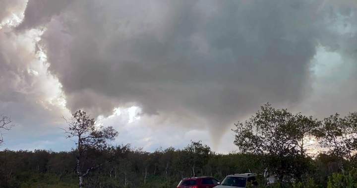 Image of a tornado touching down in the Canadian Prairies amidst a humid heatwave.