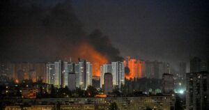 Image of fire and smoke rising from a building after a missile strike in Kyiv, Ukraine.
