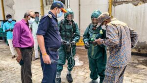 Ammonia gas leak aftermath in Tamil Nadu seafood plant, with NDRF personnel assisting victims.