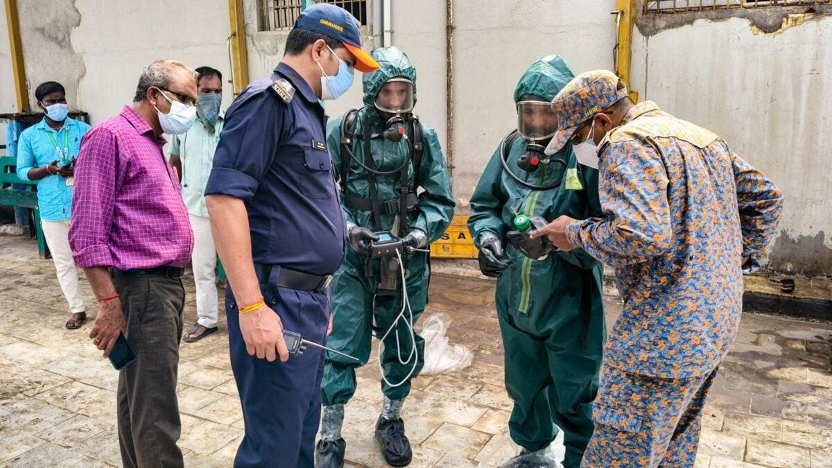 Ammonia gas leak aftermath in Tamil Nadu seafood plant, with NDRF personnel assisting victims.
