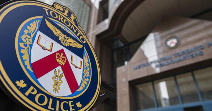 Toronto Police Service emblem photographed during a press conference.