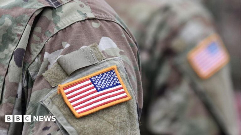 USA patch flag on a US military uniform, symbolizing military presence.