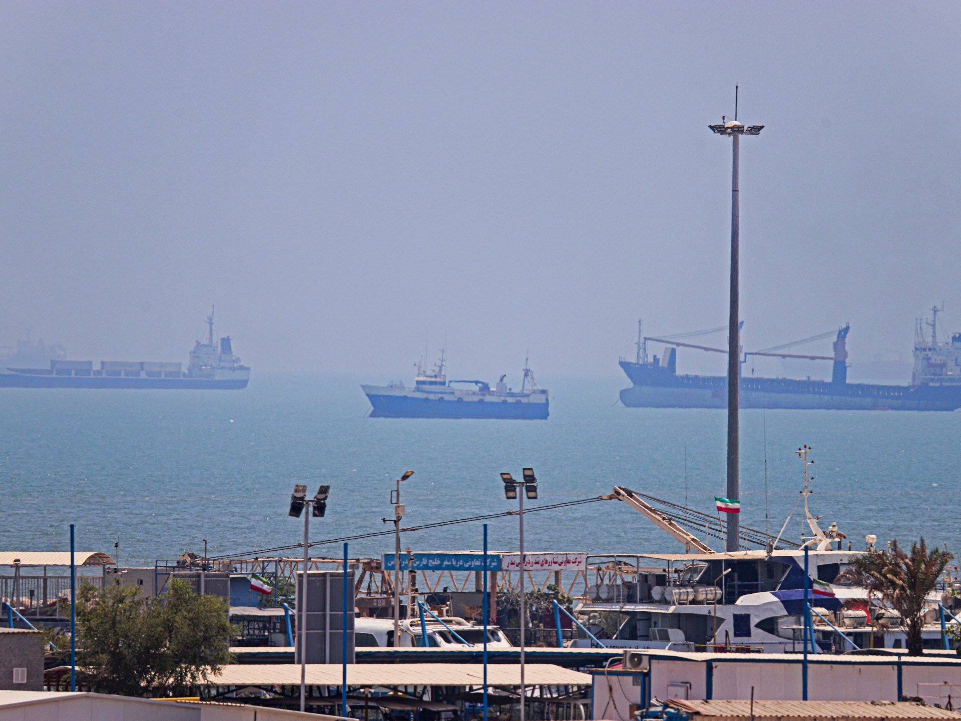 Vessels anchored in Bandar Abbas, Iran, along the Strait of Hormuz during a period of geopolitical tension and naval blockade.