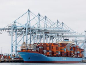Shipping containers at port, symbolizing international trade and the US trade deficit.
