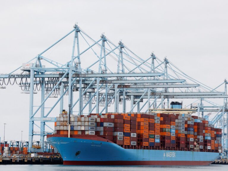 Shipping containers at port, symbolizing international trade and the US trade deficit.