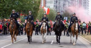 Vancouver police officers on horseback patrol during FIFA World Cup.