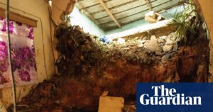 Image of a damaged room with mudslide debris, indicating the impact of West Africa floods.