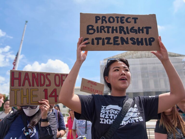 Hannah Liu holding a sign supporting birthright citizenship outside the Supreme Court.