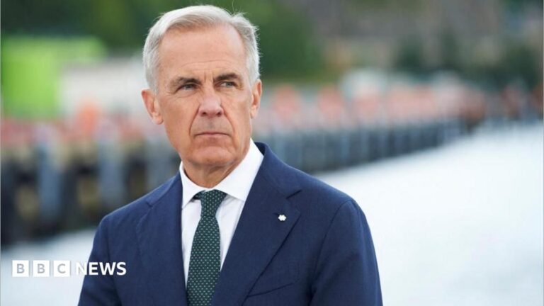 Image showing Canadian Prime Minister Mark Carney at an announcement, symbolizing Canada's firm stance in trade negotiations.