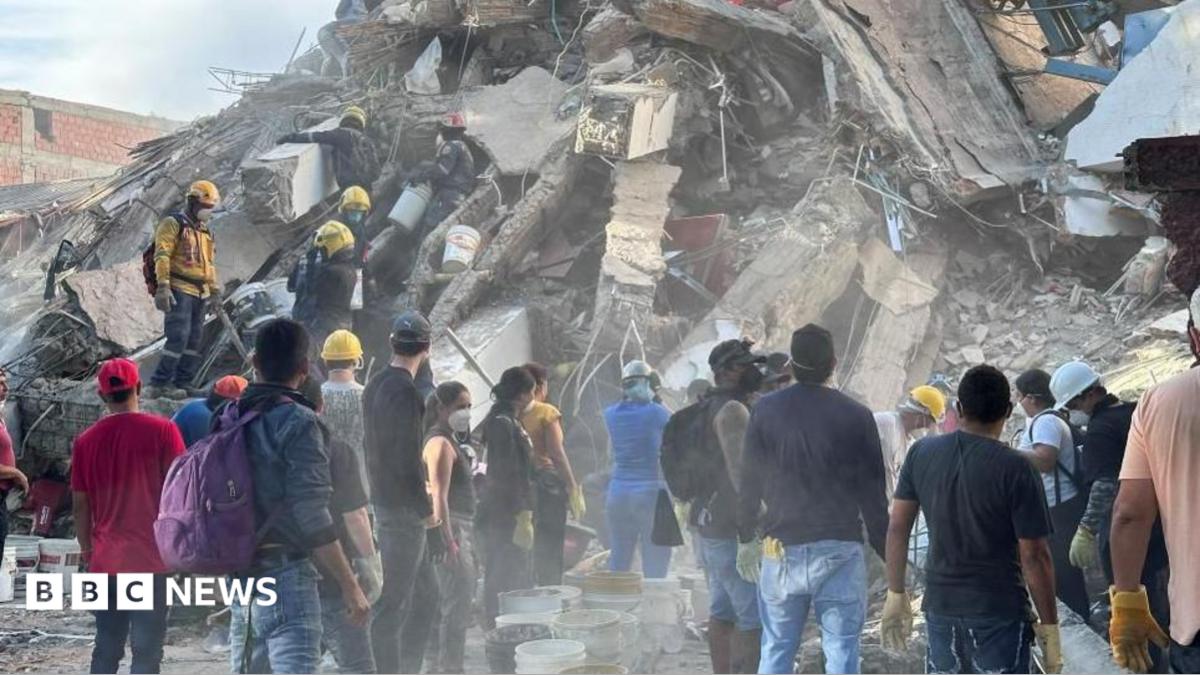 Rescue workers searching for survivors amidst rubble after a major earthquake in Colombia