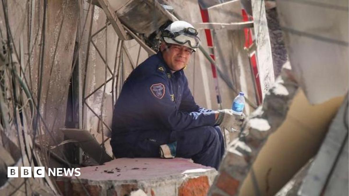 Image showing rescue workers and damaged buildings after a major earthquake in Colombia