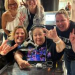 A heartwarming image of a critical care patient attending a Bryan Adams concert, facilitated by her compassionate healthcare team.