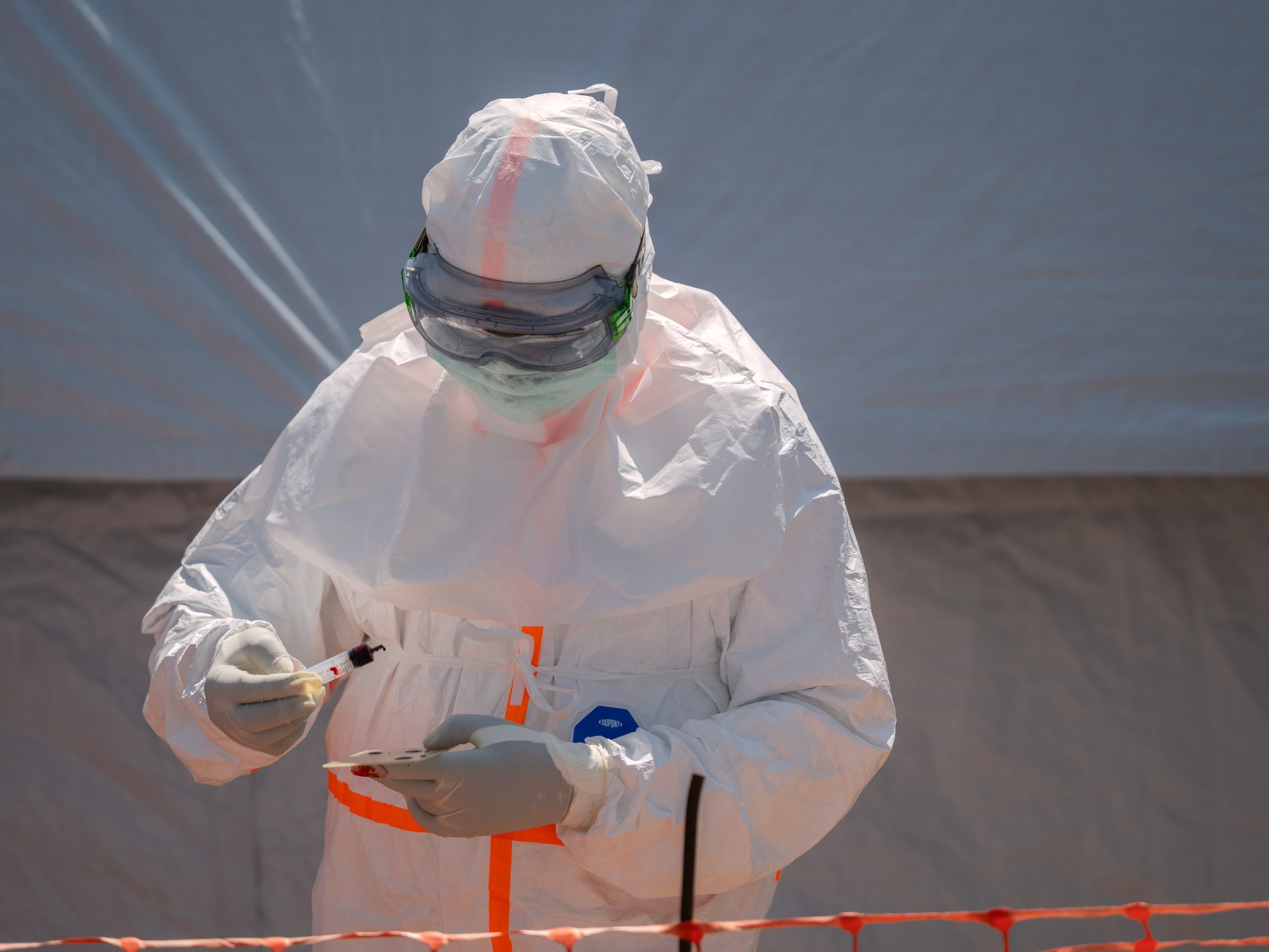 Health worker preparing a blood sample for Ebola testing at Bunia General Hospital in Bunia, DRC.