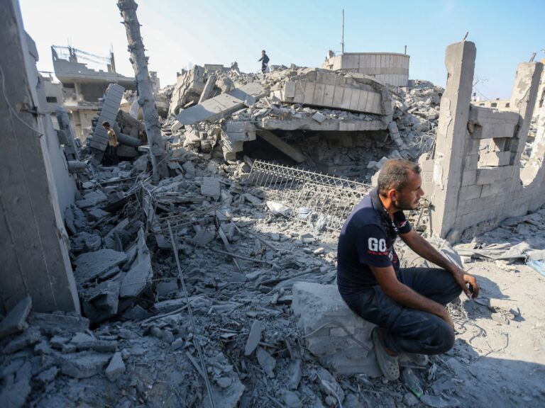 Residents inspect damage from Israeli airstrikes in Safatawi area, Gaza City