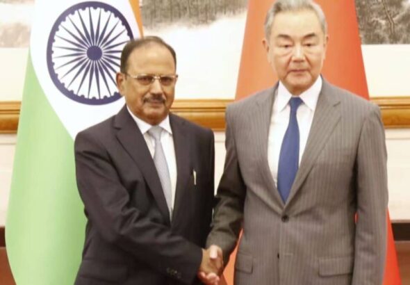 NSA Ajit Doval and Chinese Foreign Minister Wang Yi engaging in diplomatic discussions.