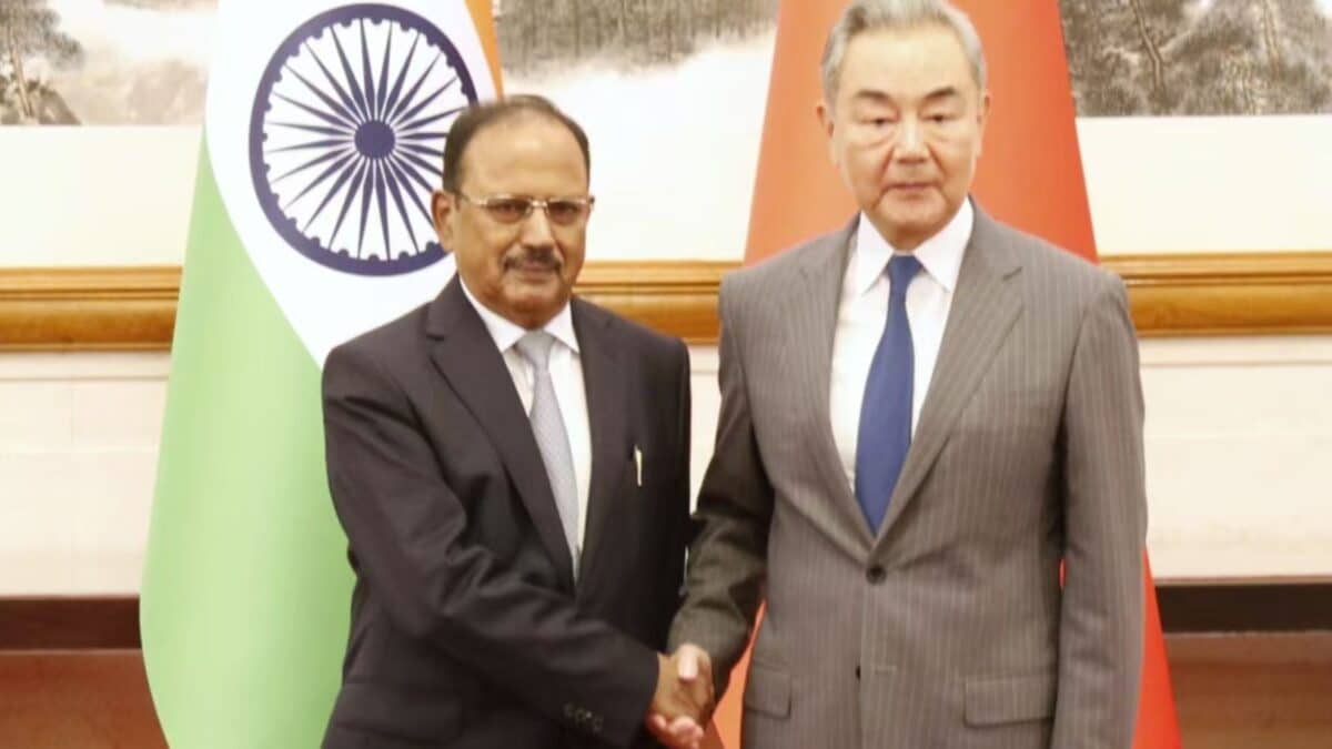 NSA Ajit Doval and Chinese Foreign Minister Wang Yi engaging in diplomatic discussions.
