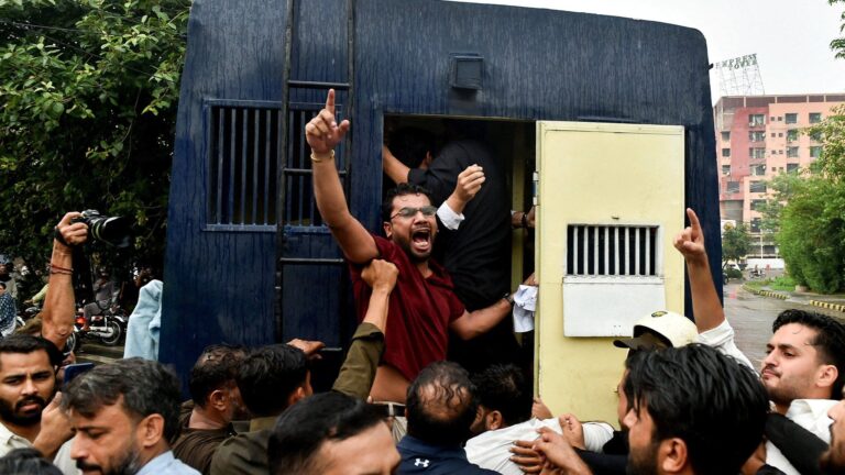 Demonstrators arrested during solidarity rally for Pakistan-administered Kashmir in Lahore, highlighting ongoing political unrest and clashes.
