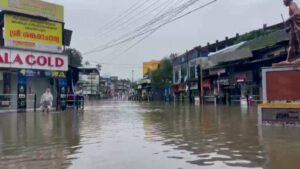 Image depicting the severe impact of floods in Kerala, India, showing submerged areas or rescue operations.