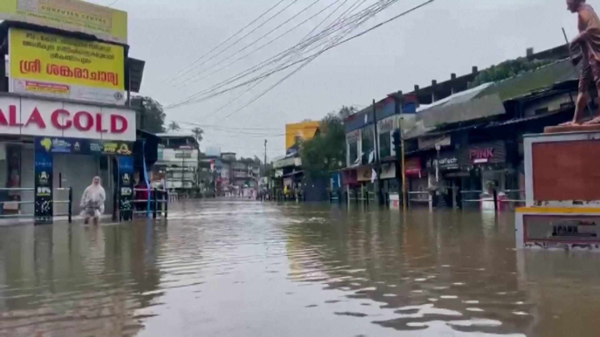 Image depicting the severe impact of floods in Kerala, India, showing submerged areas or rescue operations.