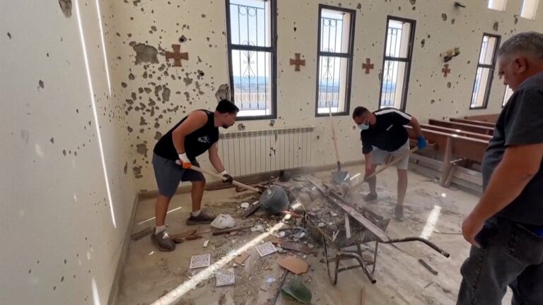 Volunteers working together to rebuild a destroyed monastery in Lebanon.