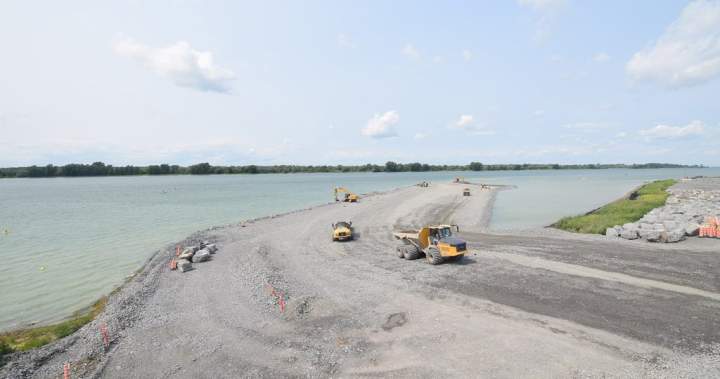 Aerial view of the Port of Montreal expansion construction site with jetty in progress.