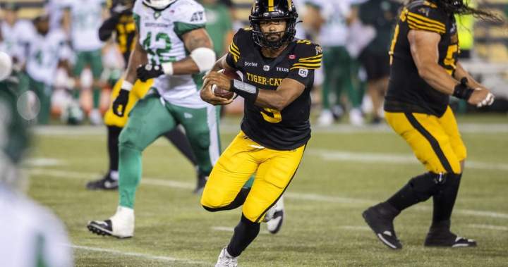 Hamilton Tiger-Cats quarterback Tre Ford runs the ball during a CFL game against the Saskatchewan Roughriders.