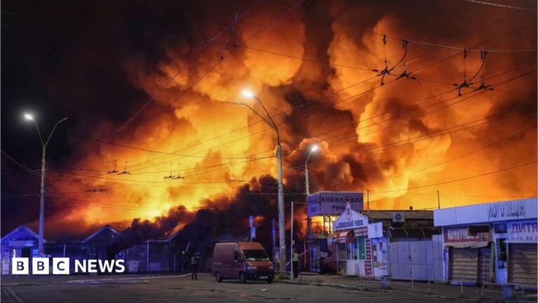 Firefighters work at a book market hit by a Russian missile strike in Kyiv, illustrating the civilian toll of the conflict.