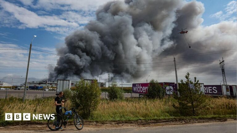 Image shows smoke plumes rising from a damaged warehouse in Russia after a large-scale drone assault.
