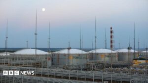 A refining and petrochemical plant in Nizhnekamsk with smoke rising, following a drone attack.