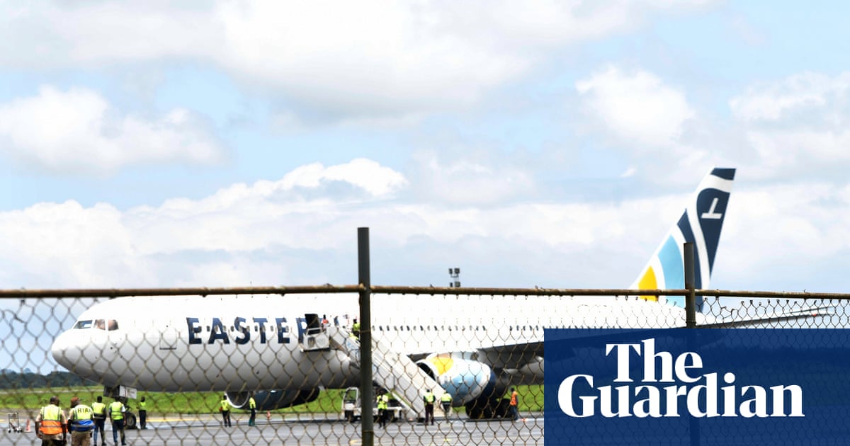 A passenger plane on the tarmac at Roberts International Airport in Monrovia, Liberia, after arriving with deportees from the United States.