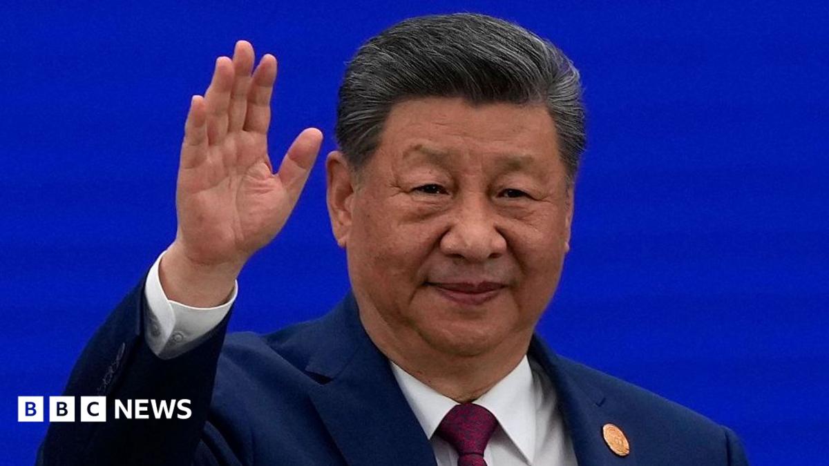 Chinese President Xi Jinping waves at the World AI Conference, amidst discussions on global AI competition.
