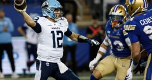 Winnipeg Blue Bombers players reacting after a missed opportunity on the field.