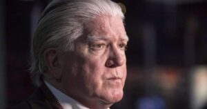 Image of Brian Burke with 'I Play Rocky' movie poster in background