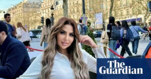 Image of Sarah Khalifa at a cafe table, a renowned Egyptian TV presenter.