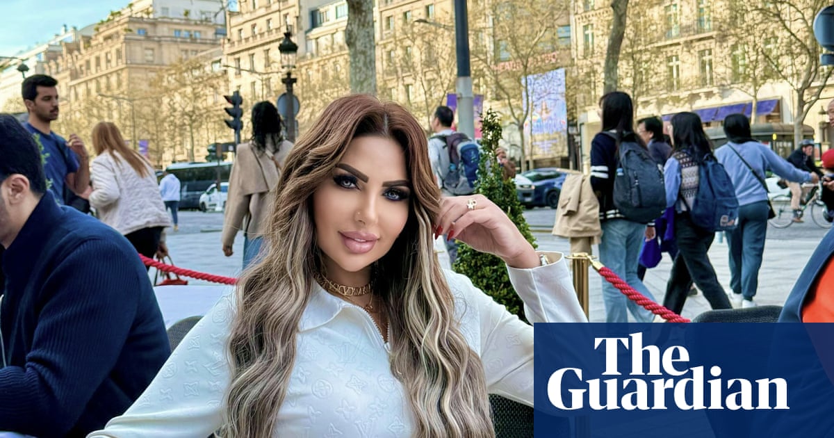 Image of Sarah Khalifa at a cafe table, a renowned Egyptian TV presenter.
