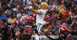 Edmonton Elks player Austin Mack catches a pass during the Labour Day Classic against the Calgary Stampeders.