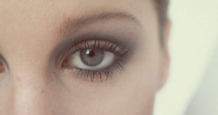 A close-up image of an eye with vibrant makeup, showcasing the eyemaxxing beauty trend.