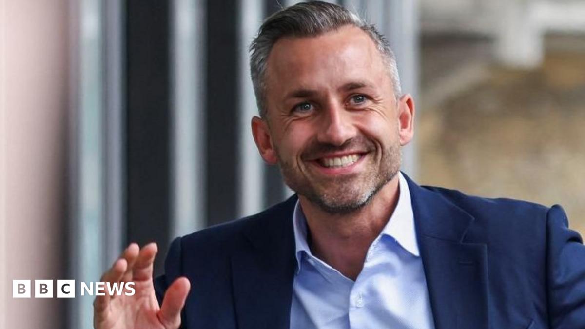 Ulrich Siegmund, the AfD's leader in Saxony-Anhalt, smiles and waves, signifying the party's election victory and mandate to govern.